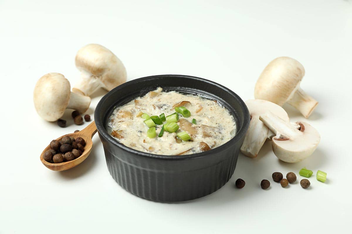 boglar_0001_concept-tasty-food-with-mushroom-sauce-white-background
